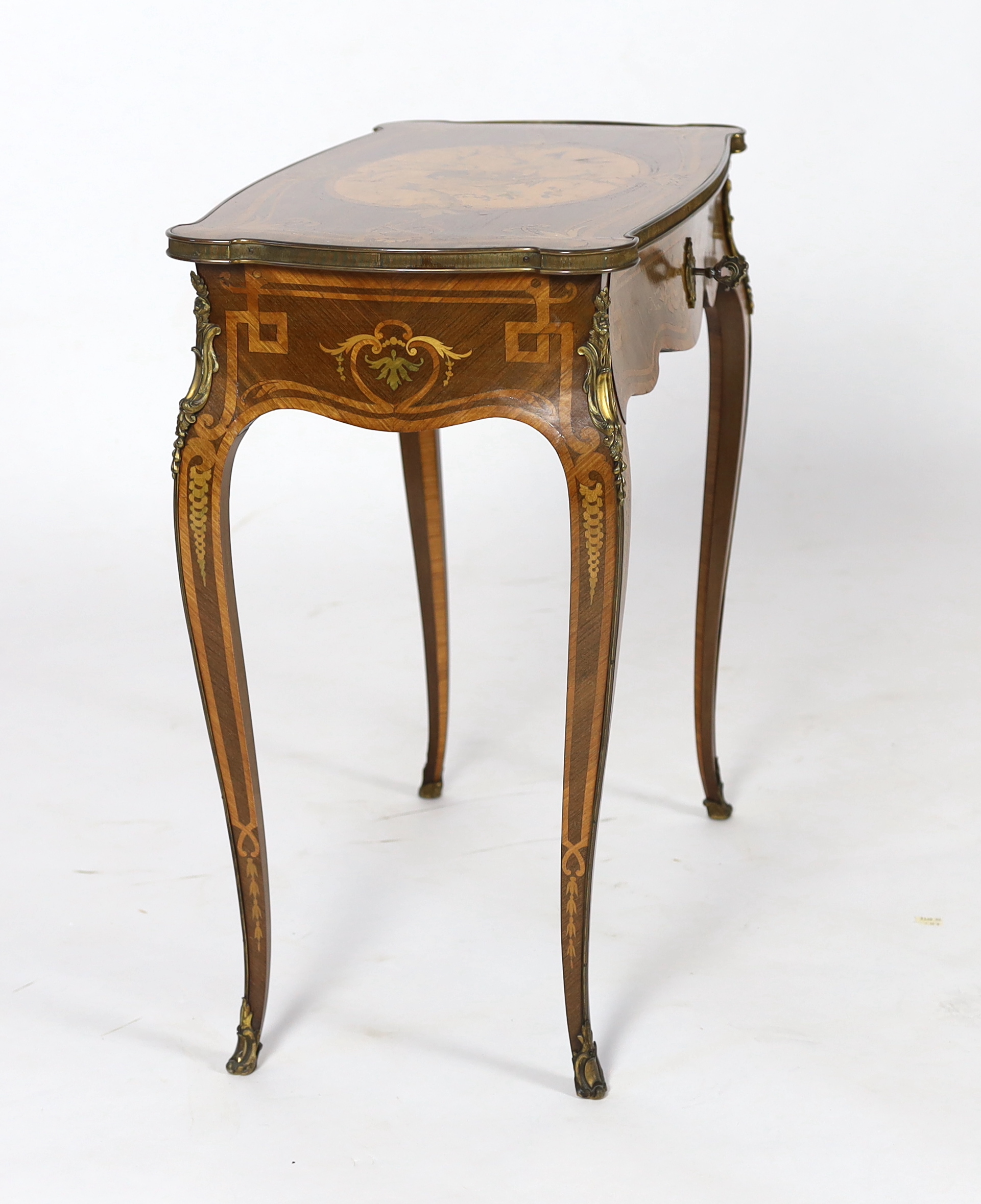 A Louis XV style marquetry side table, 66cm wide, 37cm deep, 68cm high, Please note this lot attracts an additional import tax of 5% on the hammer price